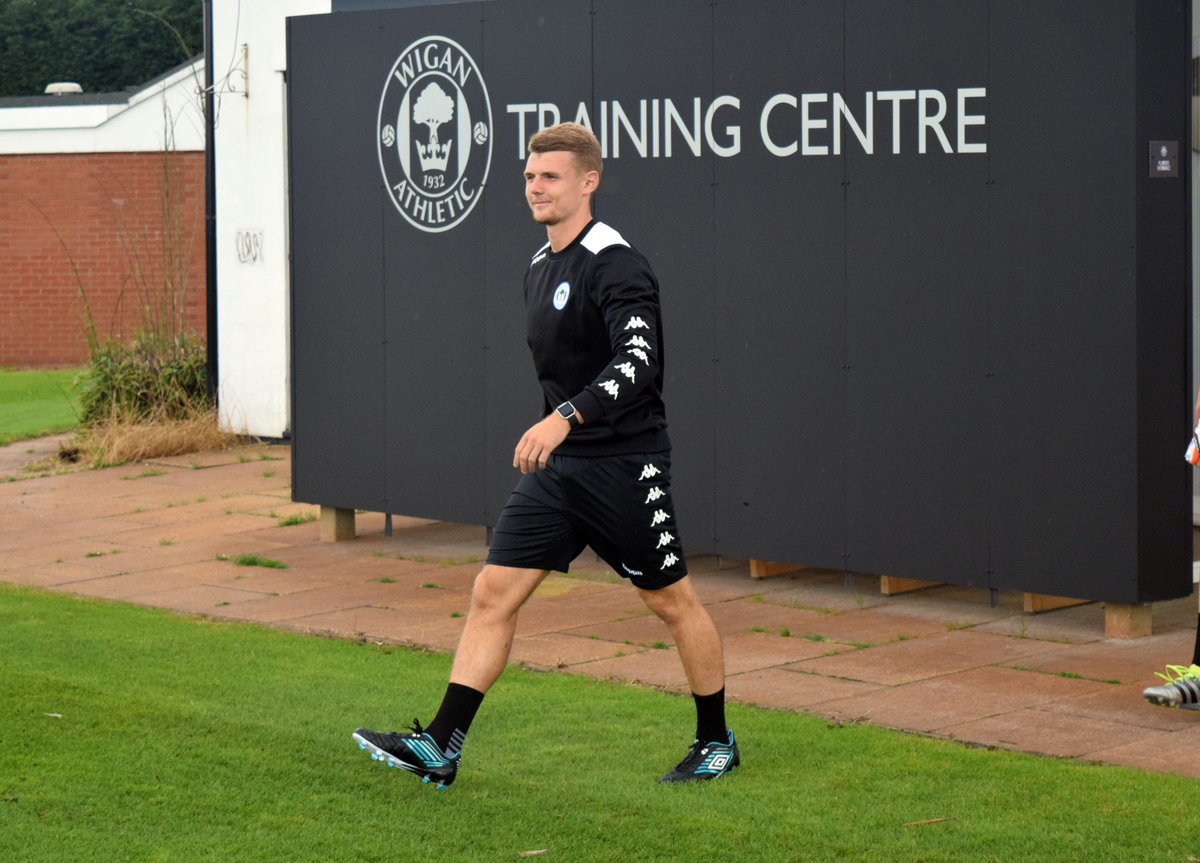 Why was Wigan’s training ground sold to Preston North End?